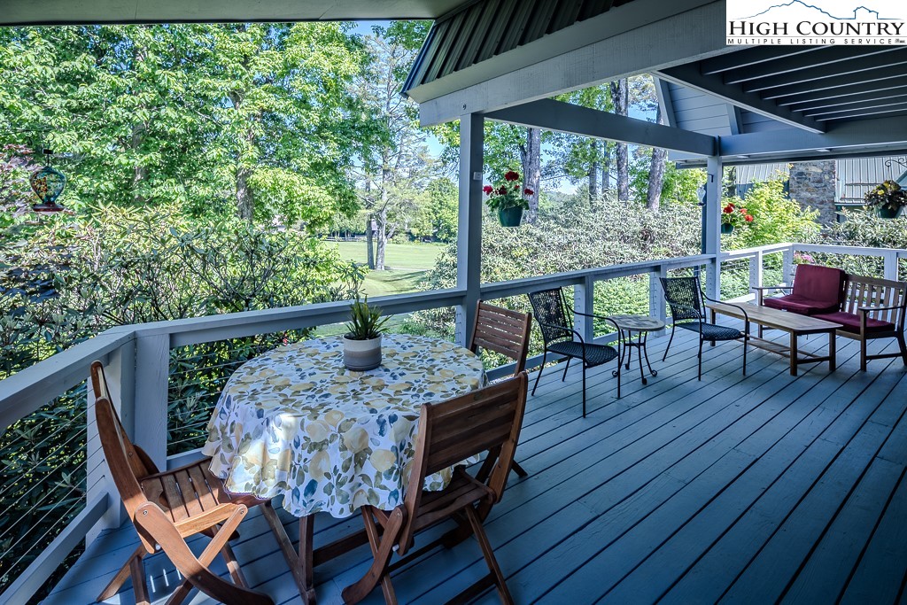 183 Rhododendron Loop Newland, NC 28657 - Photo 33 of 49 a view of a chairs and table in the balcony