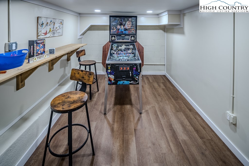 183 Rhododendron Loop Newland, NC 28657 - Photo 41 of 49 a view of a room with furniture and wooden floor