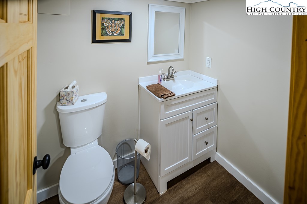 183 Rhododendron Loop Newland, NC 28657 - Photo 42 of 49 a bathroom with a toilet sink and mirror
