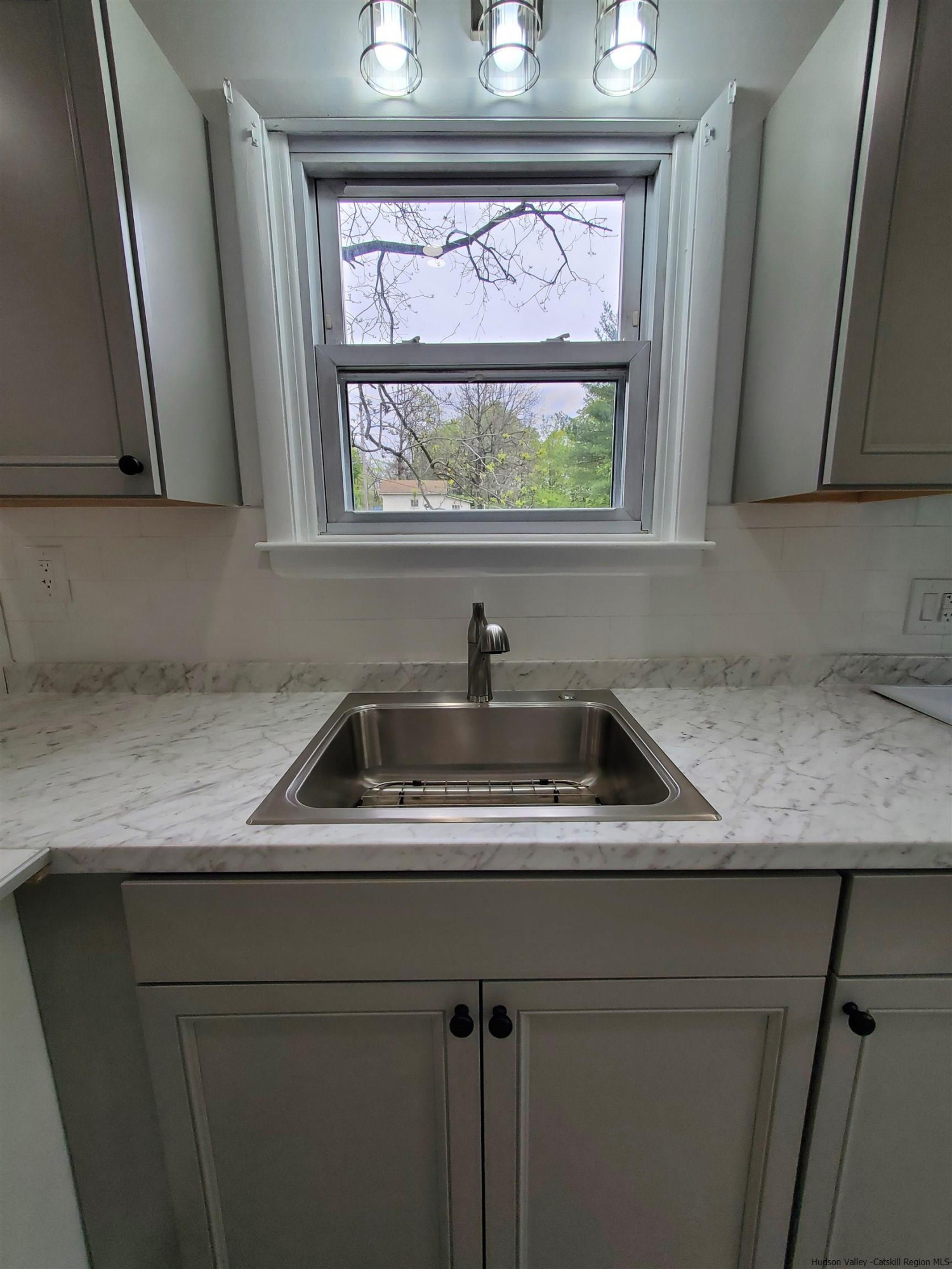 326 Boulevard Kingston, NY 12401 - Photo 11 of 35 a kitchen with a sink and a window