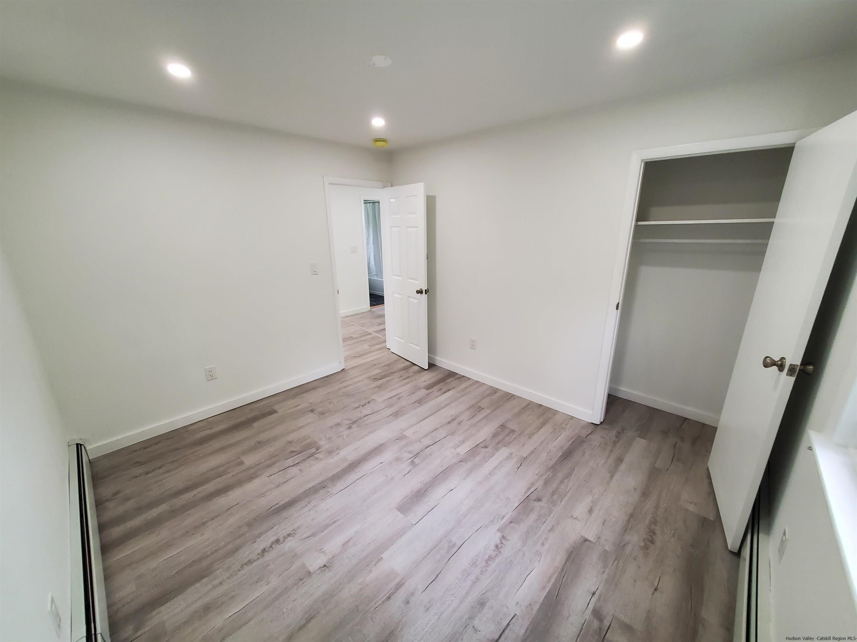 326 Boulevard Kingston, NY 12401 - Photo 13 of 35 an empty room with wooden floor and entrance