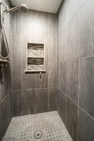 a view of a backyard with table and chairs couches and a fire pit