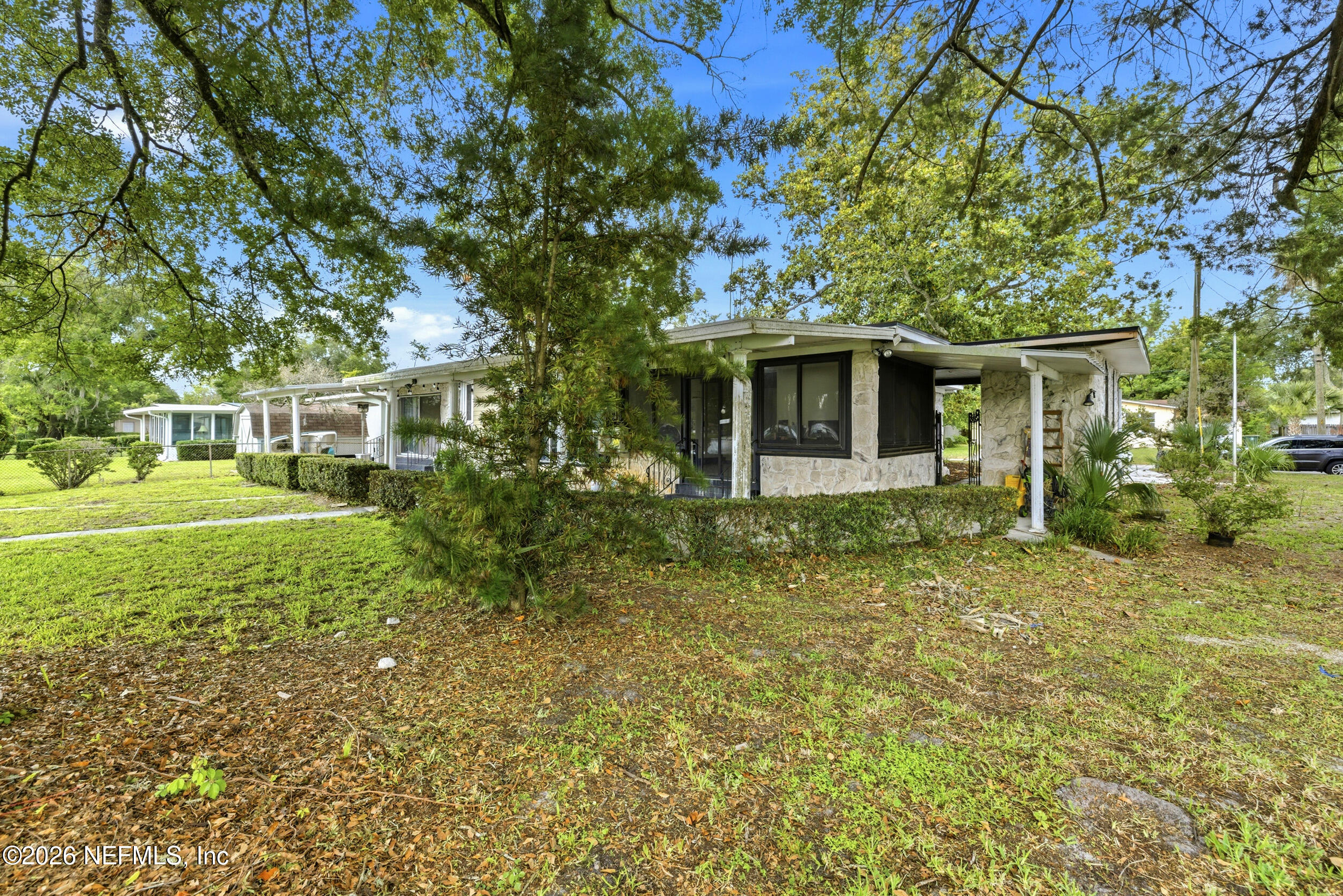 7484 Spinola Road Jacksonville, FL 32217 - Photo 55 of 63 a front view of a house with garden