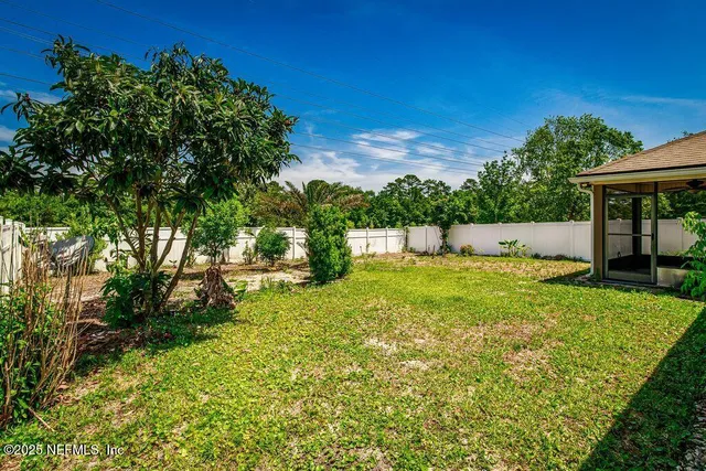 an aerial view of a house with a lake view