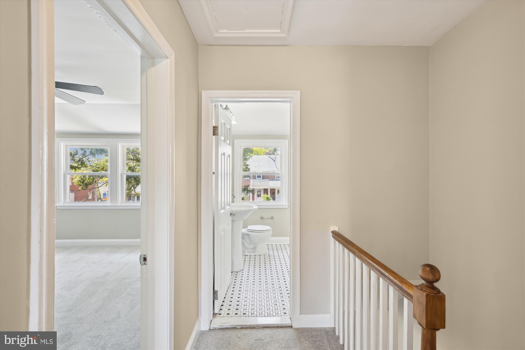 4545 Marble Hall Road Baltimore, MD 21239 - Photo 29 of 36 a view of a hallway with wooden floor and a dining room