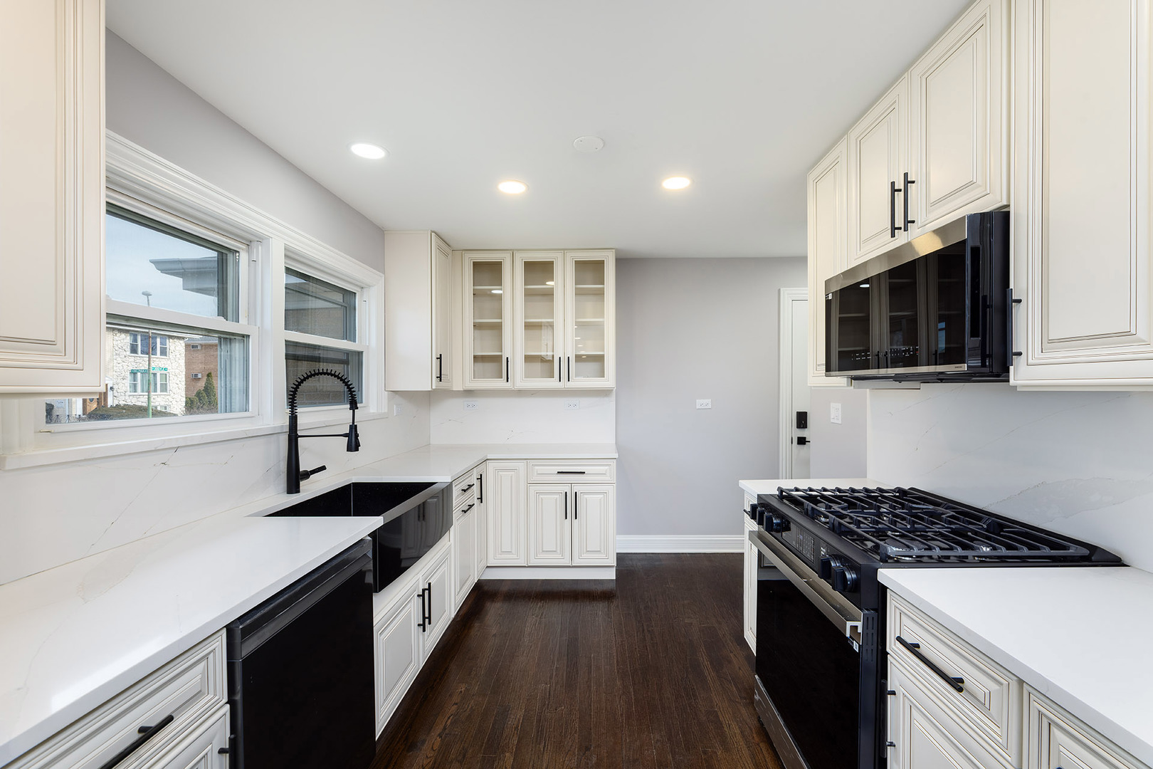 4955 North Delphia Avenue Norridge, IL 60706 - Photo 11 of 36 a kitchen with stainless steel appliances a sink dishwasher stove microwave and cabinets