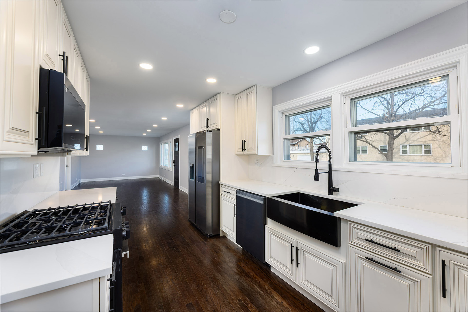 4955 North Delphia Avenue Norridge, IL 60706 - Photo 12 of 36 a kitchen with stainless steel appliances a sink stove and refrigerator