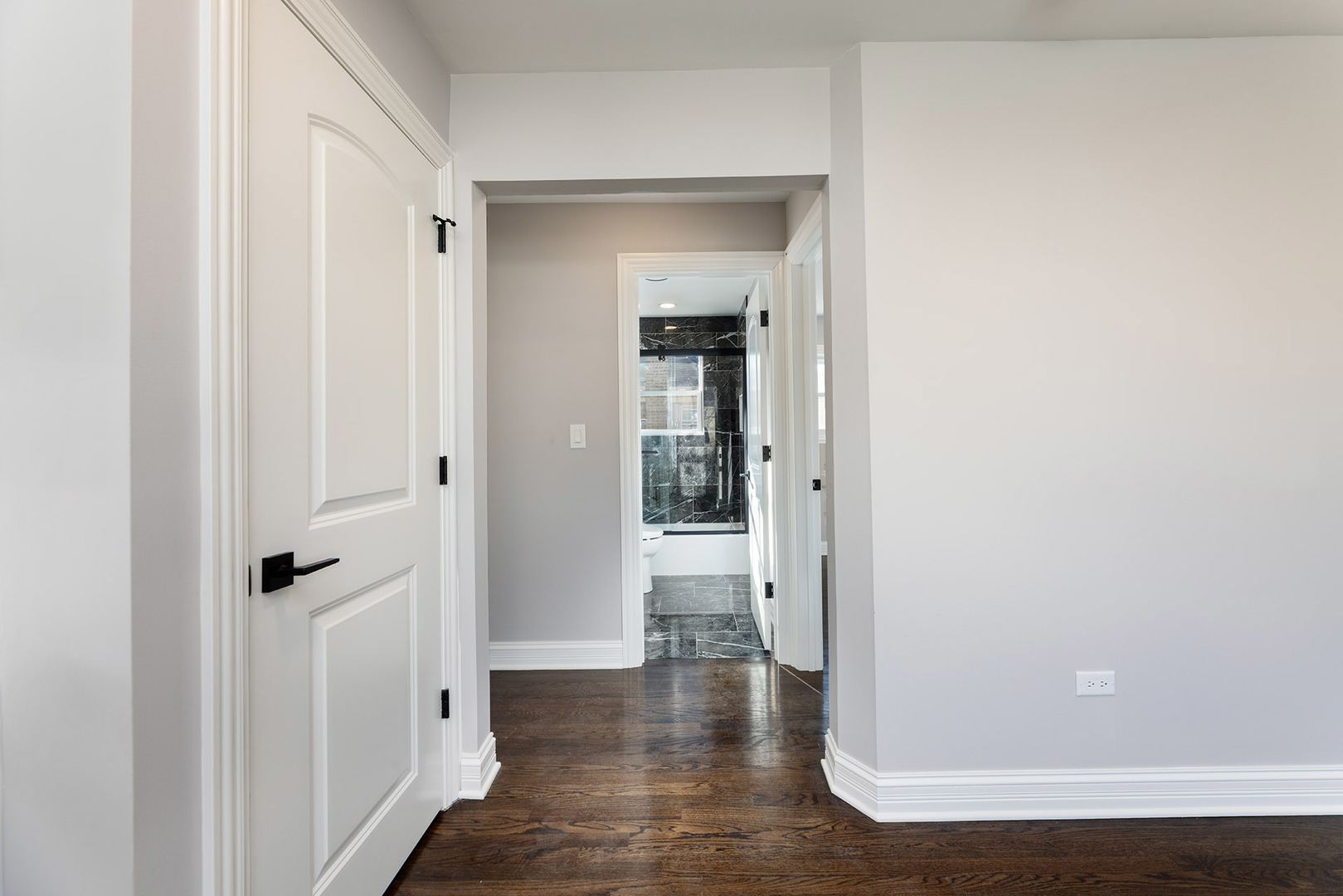 4955 North Delphia Avenue Norridge, IL 60706 - Photo 17 of 36 a view of a hallway with wooden floor