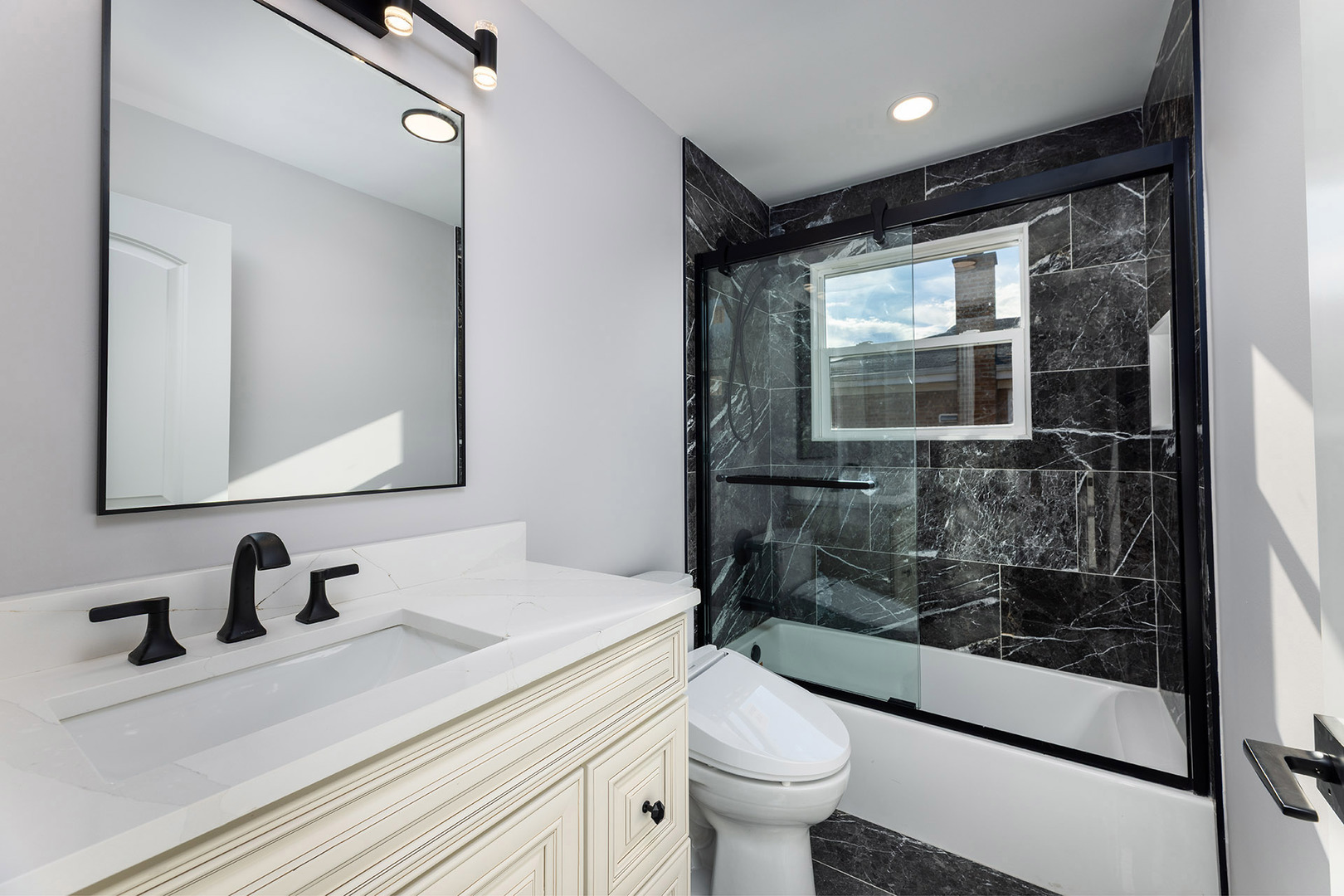 4955 North Delphia Avenue Norridge, IL 60706 - Photo 18 of 36 a bathroom with a sink toilet a mirror and shower