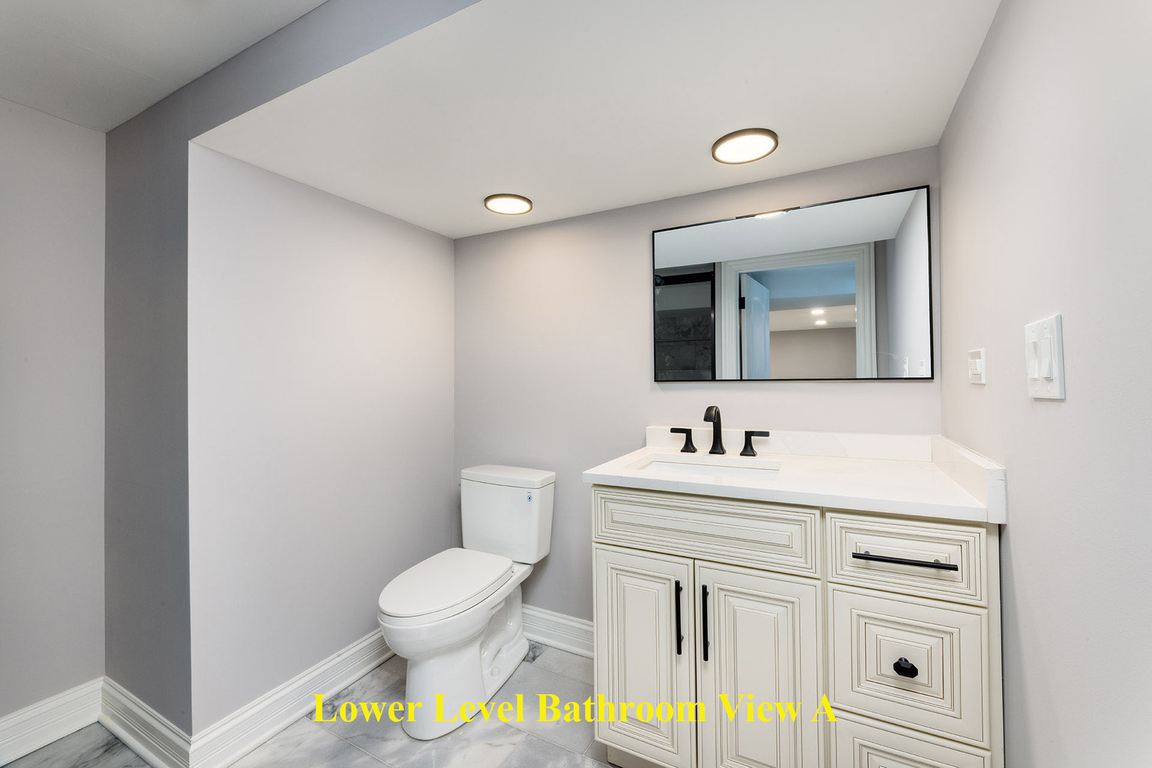 4955 North Delphia Avenue Norridge, IL 60706 - Photo 27 of 36 a bathroom with a toilet sink and mirror