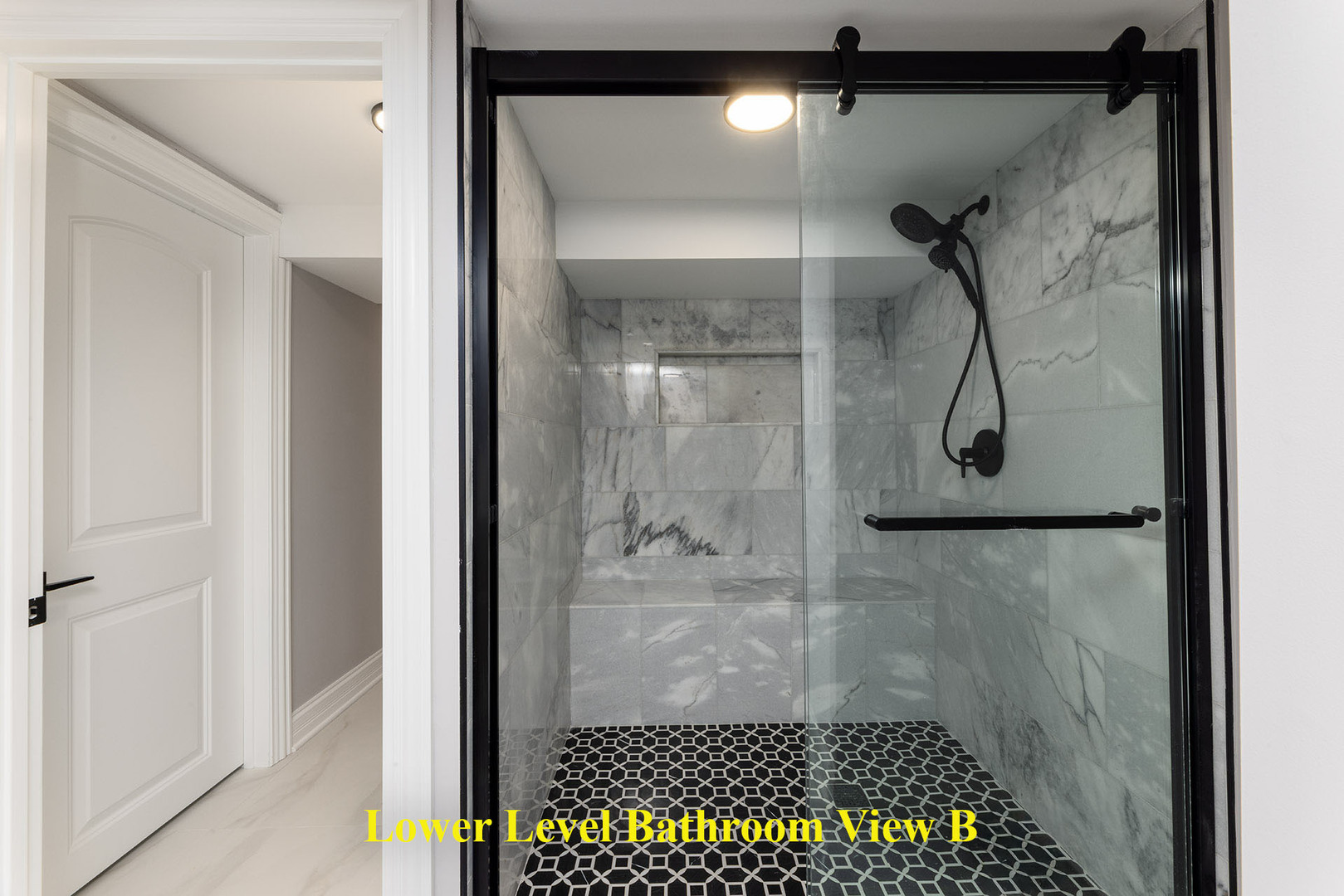 4955 North Delphia Avenue Norridge, IL 60706 - Photo 28 of 36 a bathroom with a glass shower door