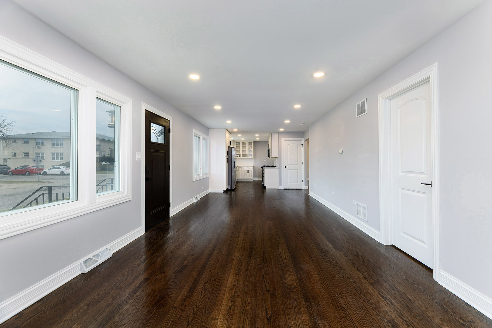 4955 North Delphia Avenue Norridge, IL 60706 - Photo 6 of 36 a view of empty room with wooden floor and fan