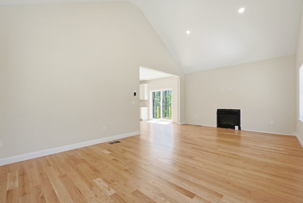 112 West Meadow Road Townsend, MA 01474 - Photo 11 of 38 a view of an empty room with wooden floor and a window