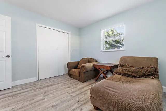 a bedroom with two beds and a window