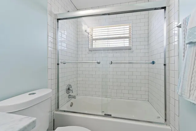 a bathroom with a shower and a bathtub