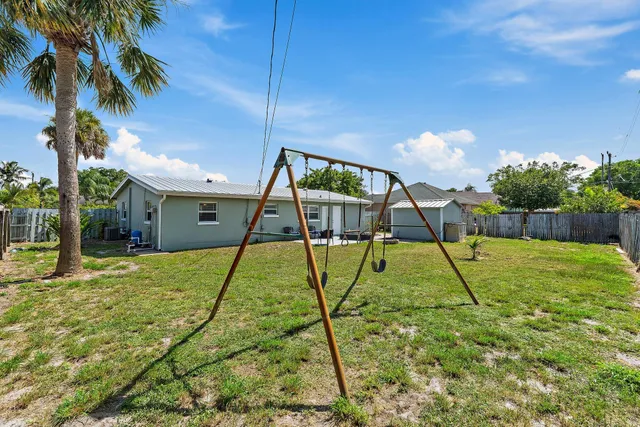 a view of swimming pool with a backyard