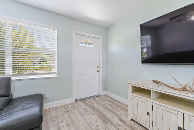 a bedroom with a bed and a television