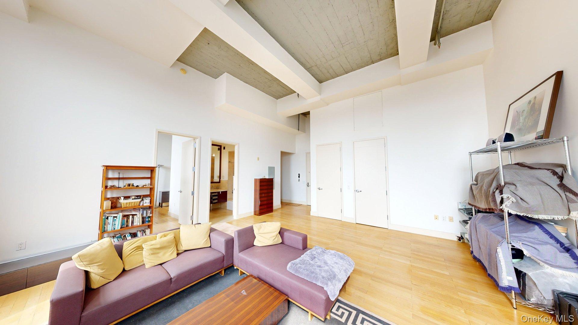 25 Leroy Place, Unit 509 New Rochelle, NY 10805 - Photo 4 of 12 a living room with furniture and a wooden floor