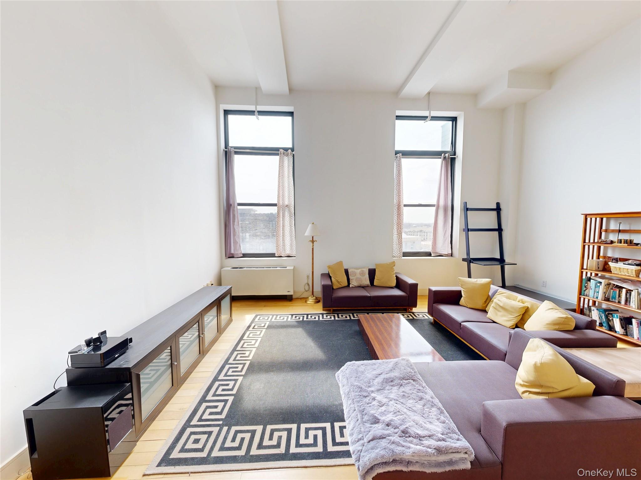 25 Leroy Place, Unit 509 New Rochelle, NY 10805 - Photo 5 of 12 a living room with furniture and a potted plant