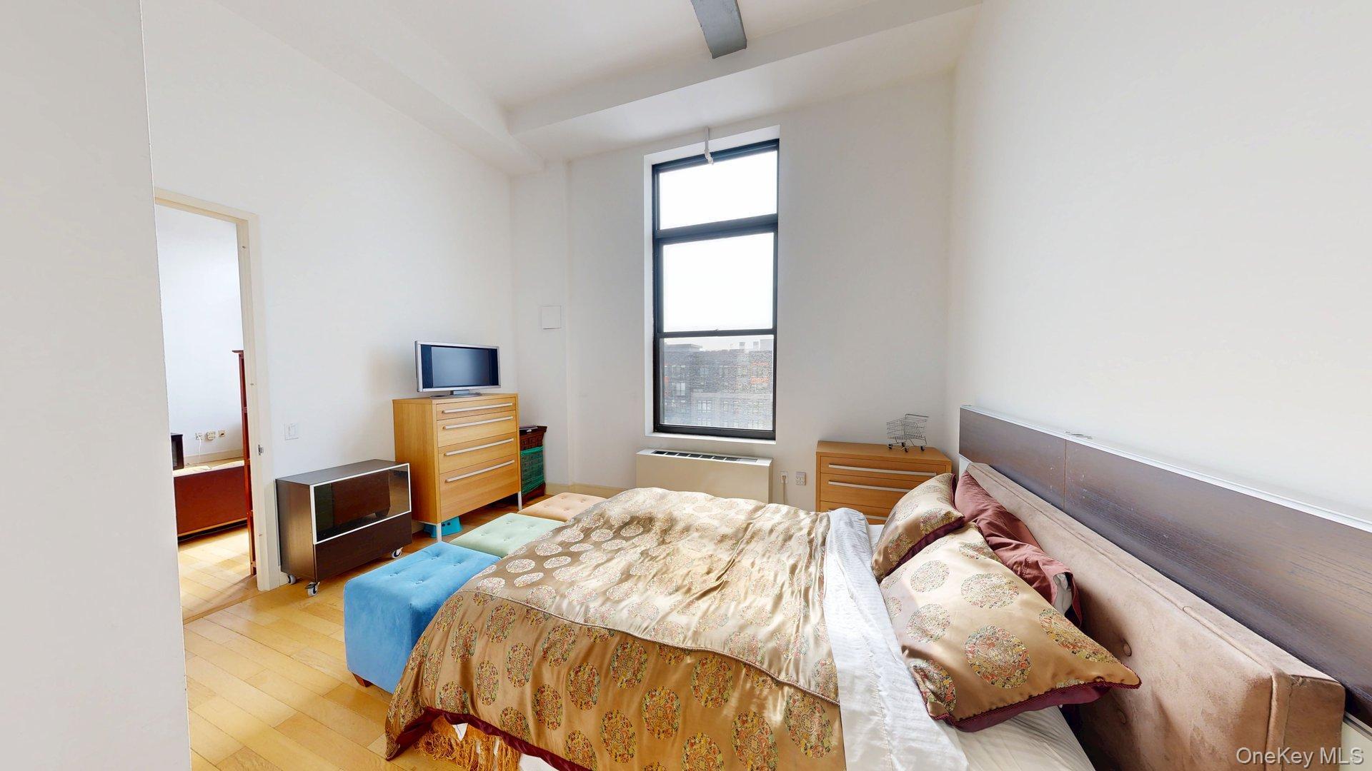 25 Leroy Place, Unit 509 New Rochelle, NY 10805 - Photo 8 of 12 a bedroom with a bed and a window