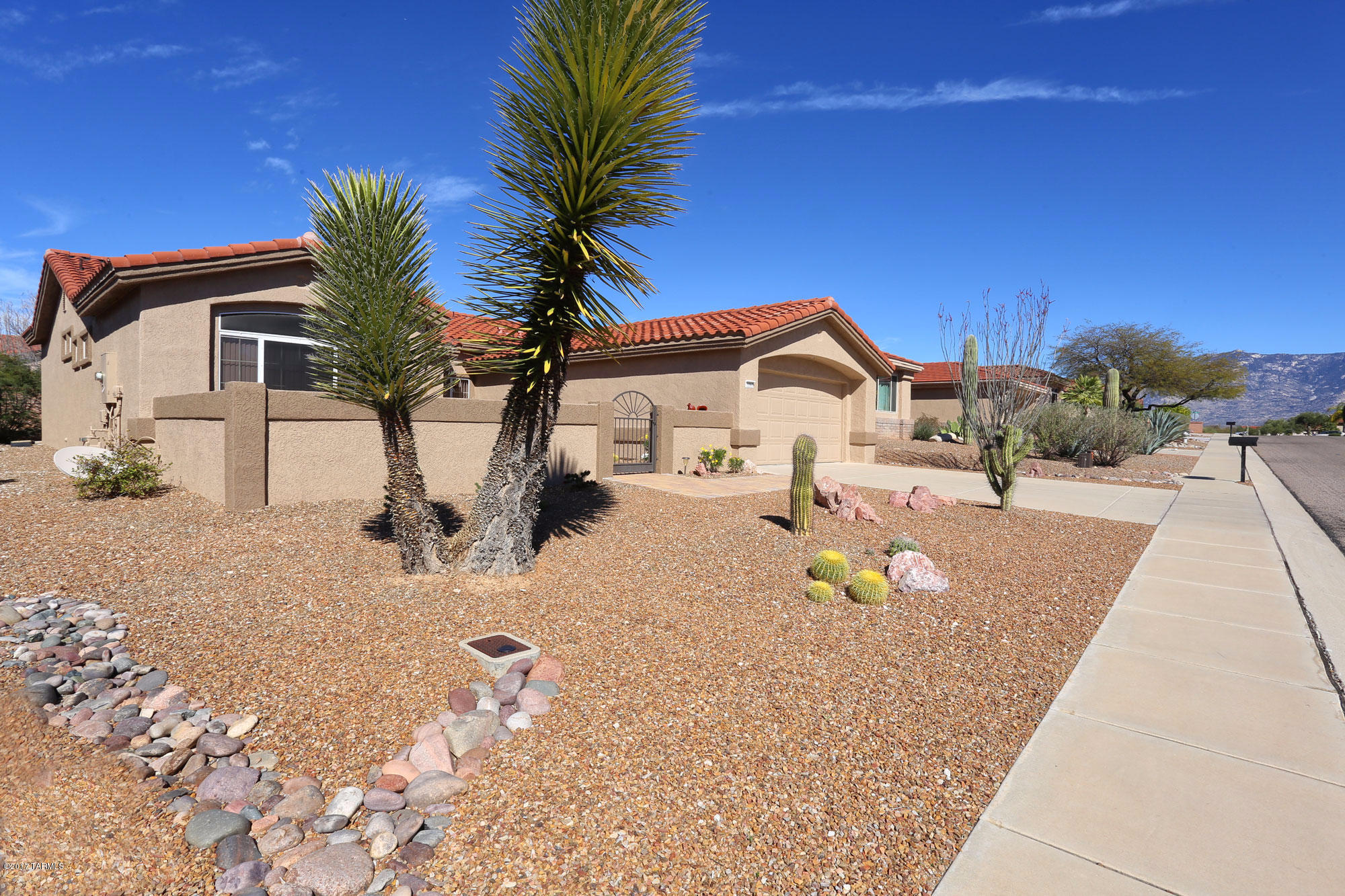 1065 East Royal Oak Road Oro Valley, AZ 85755 - Photo 4 of 19 a view of a house with a snow on the road