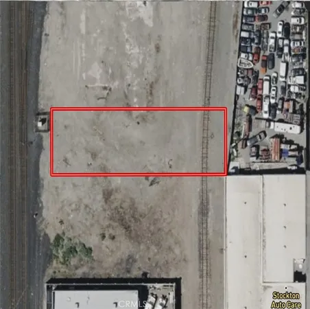 an aerial view of a house with a street