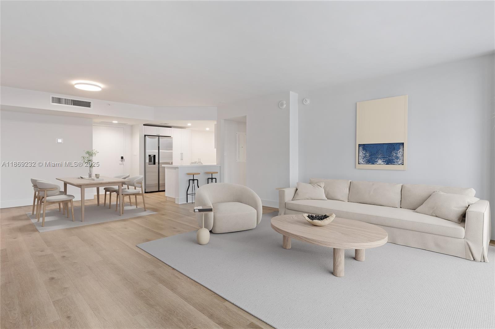 555 Northeast 34th Street, Unit 2706 Miami, FL 33137 - Photo 1 of 1 a living room with furniture and a table