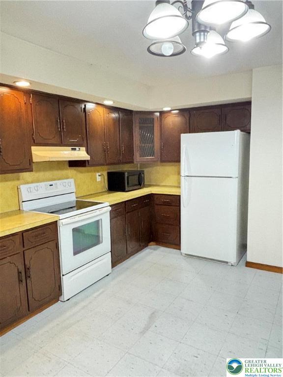 2027 Willow Park Road, Unit 7 Bethlehem, PA 18020 - Photo 20 of 27 a kitchen with cabinets and white stainless steel appliances