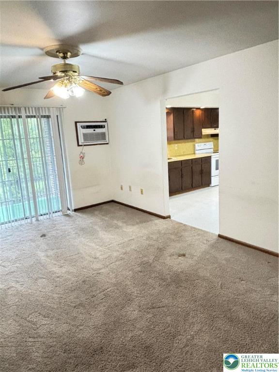 2027 Willow Park Road, Unit 7 Bethlehem, PA 18020 - Photo 26 of 27 an empty room with windows and ceiling fan