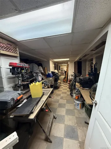 a room with gym equipment and a table