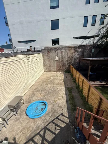 a view of a livingroom with furniture and staircase