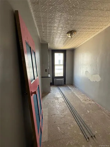 a view of entryway with stairs and a window