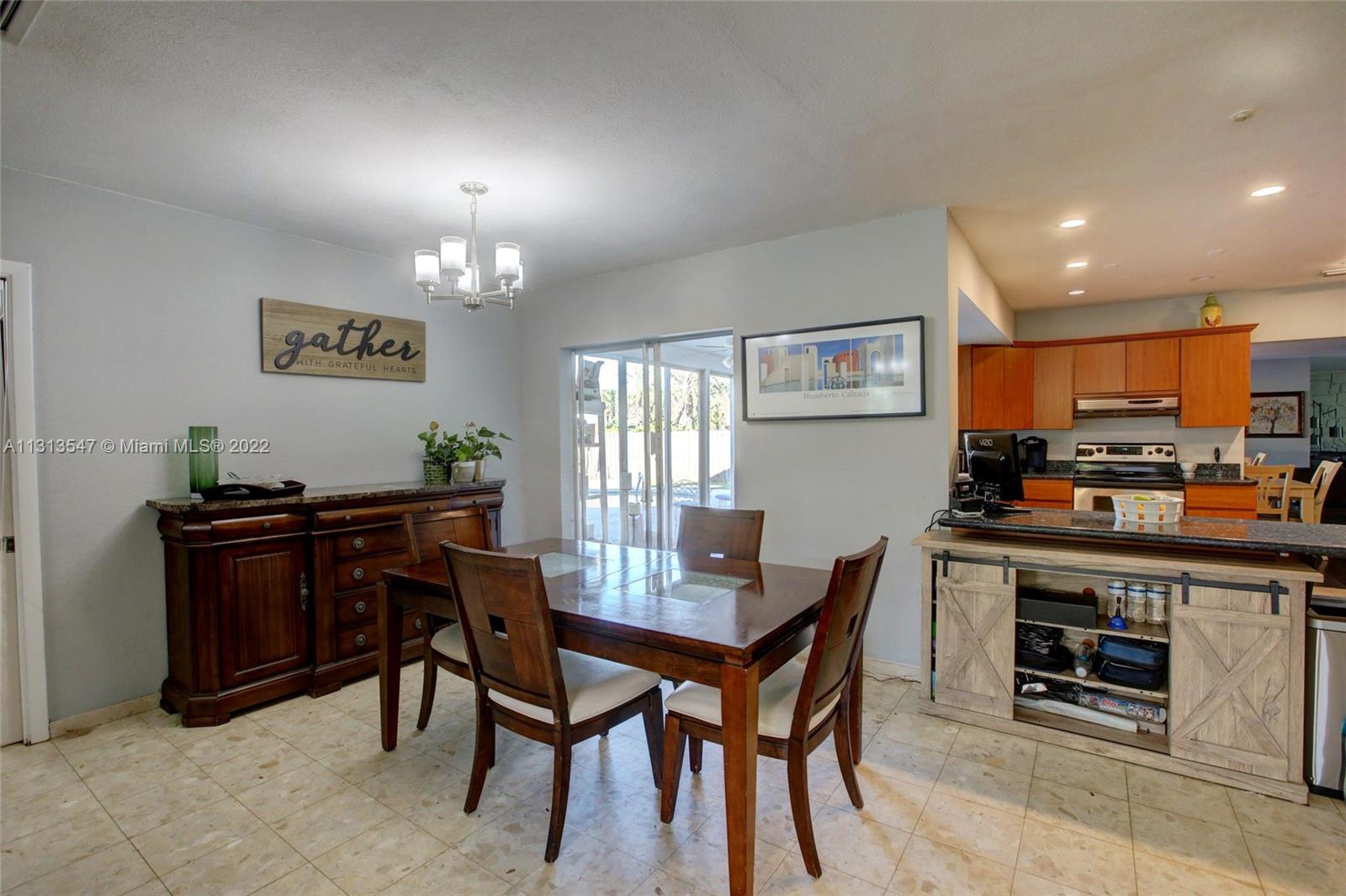 6681 Peters Road Plantation, FL 33317 - Photo 12 of 27 a view of a dining room with furniture