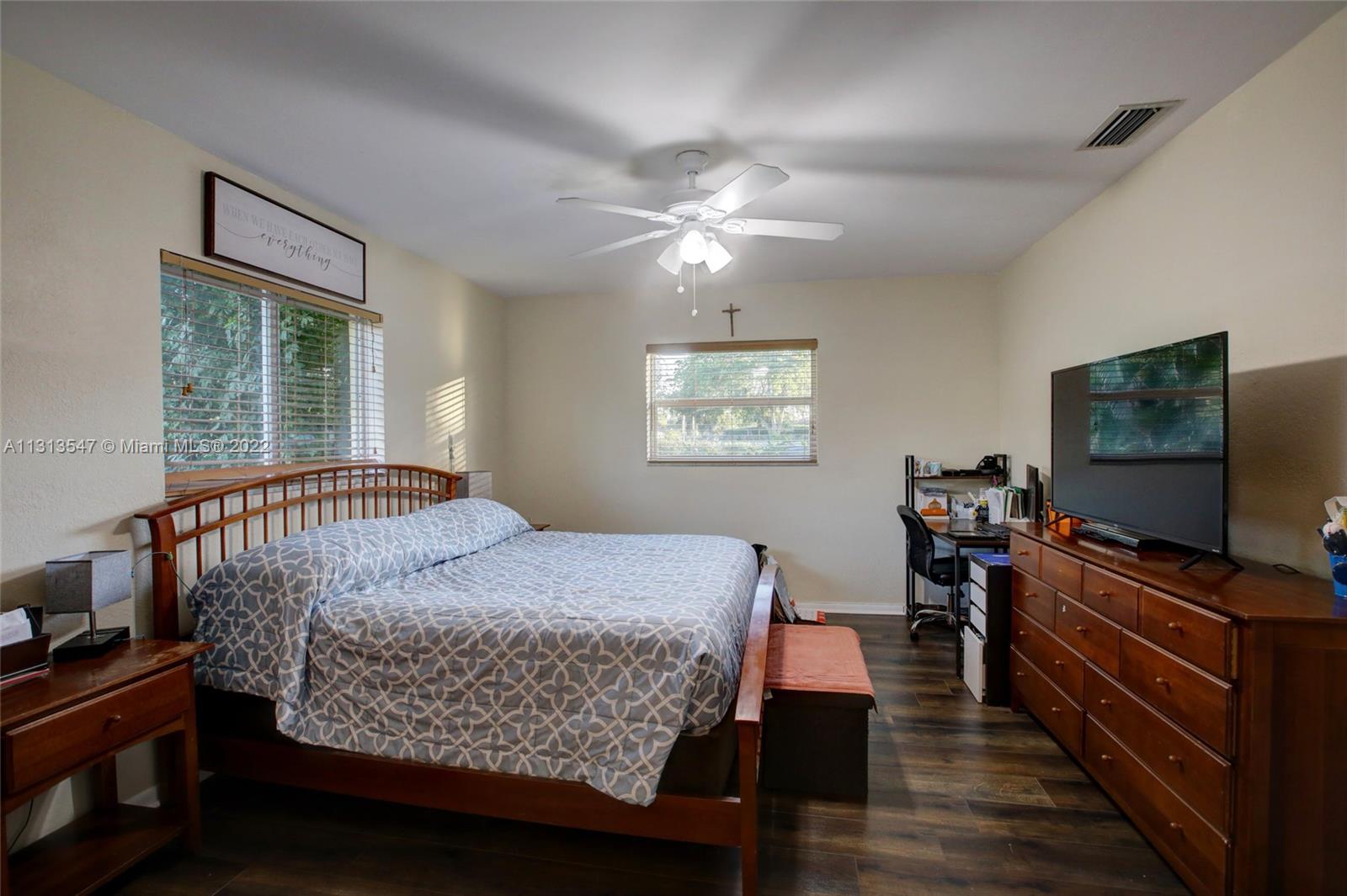 6681 Peters Road Plantation, FL 33317 - Photo 21 of 27 a bedroom with a bed and a flat screen tv