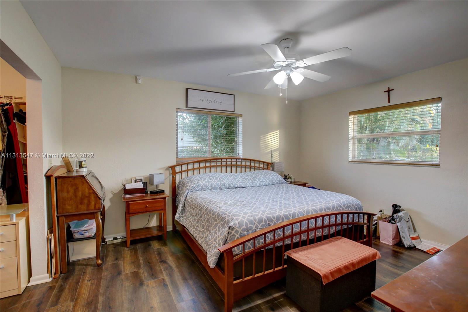 6681 Peters Road Plantation, FL 33317 - Photo 22 of 27 a bedroom with furniture and a chandelier