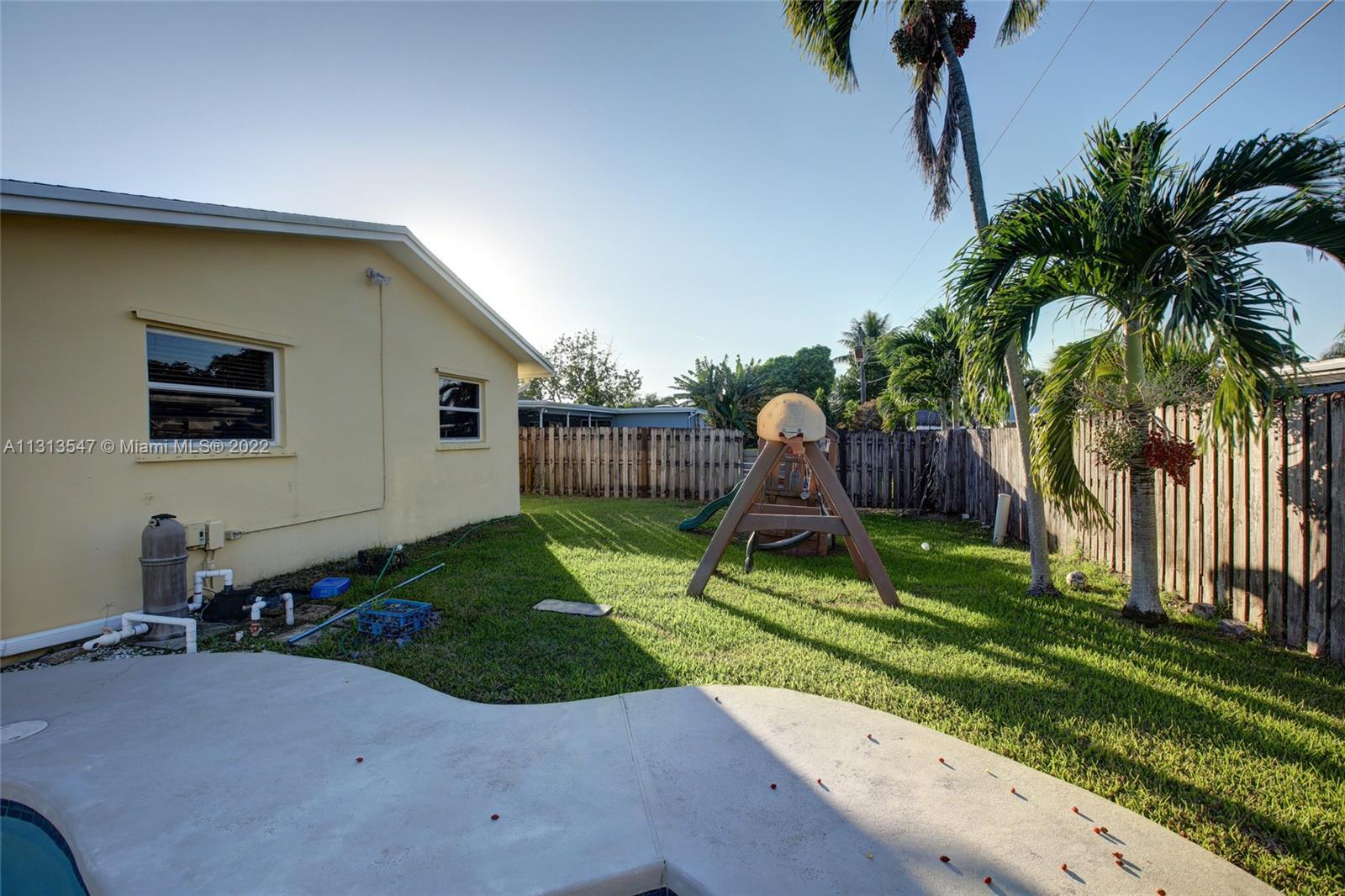 6681 Peters Road Plantation, FL 33317 - Photo 27 of 27 a view of backyard with a garden and entertaining space