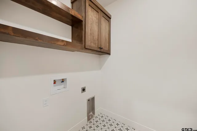 a bathroom with a shower and cabinets