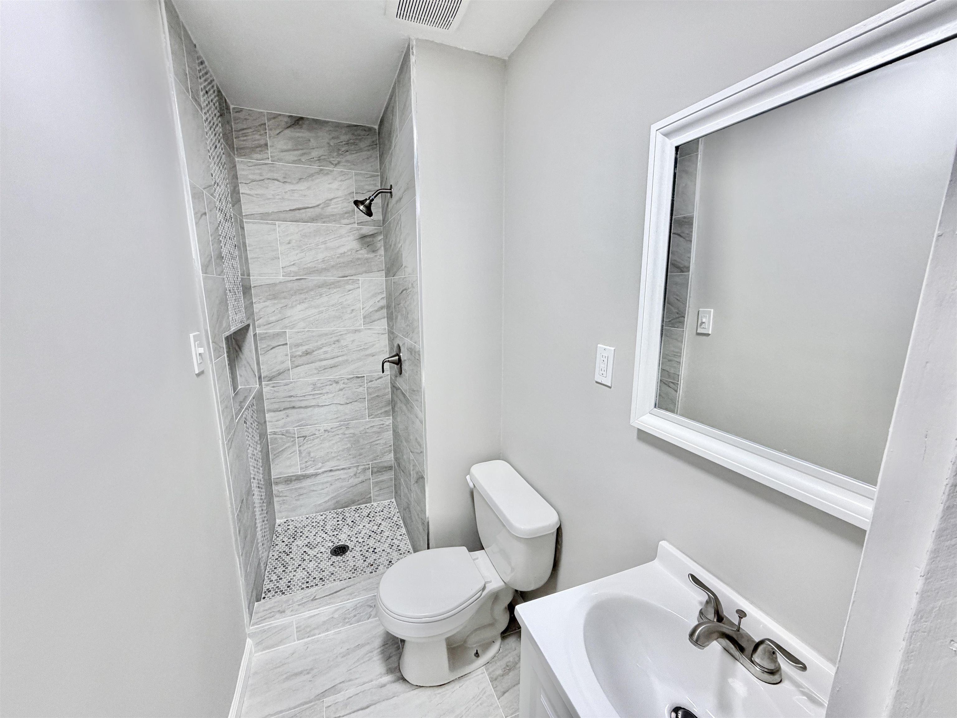 7830 Quito Road Millington, TN 38053 - Photo 17 of 26 a bathroom with a sink and a toilet