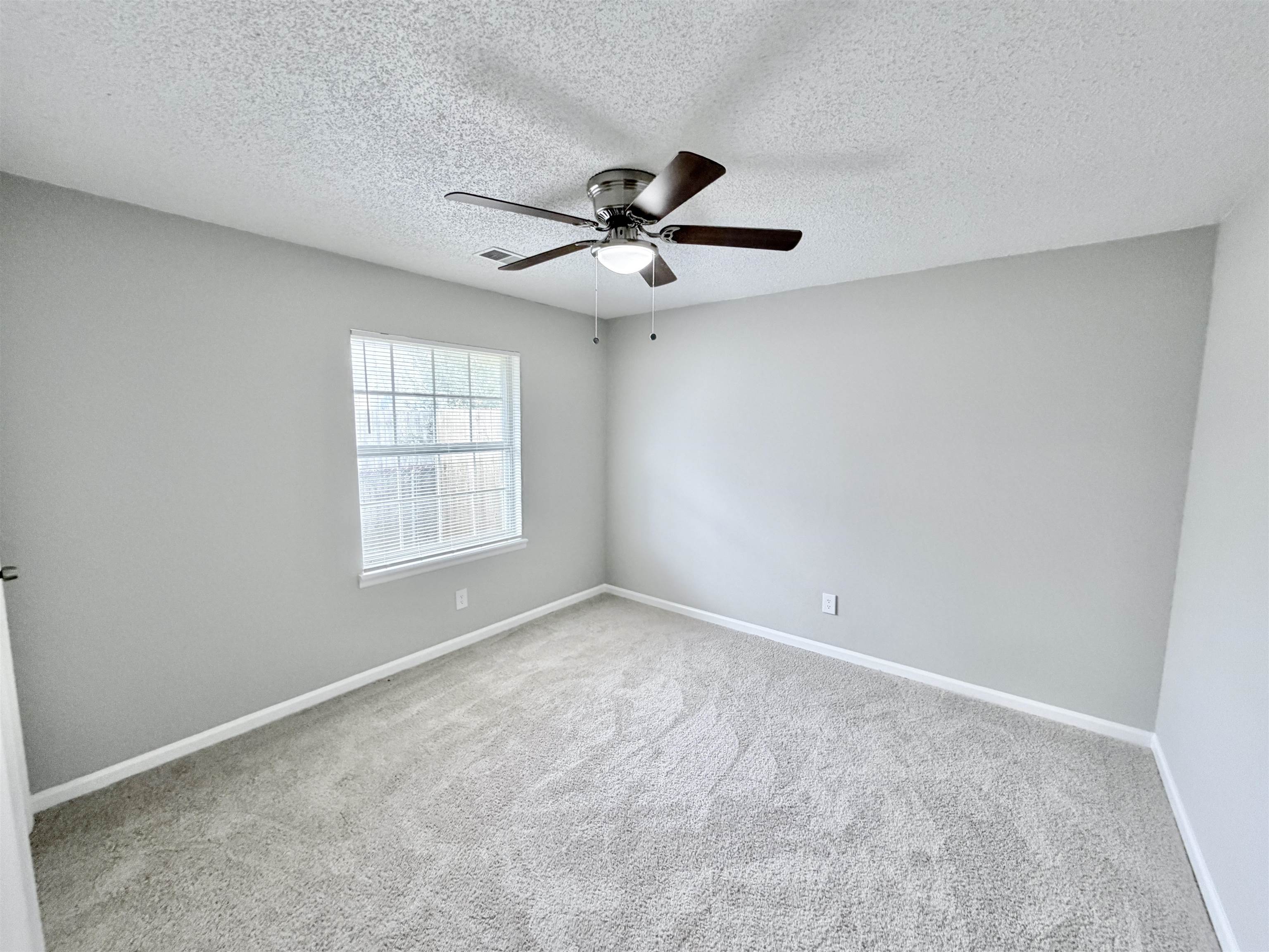 7830 Quito Road Millington, TN 38053 - Photo 19 of 26 a view of an empty room with a window