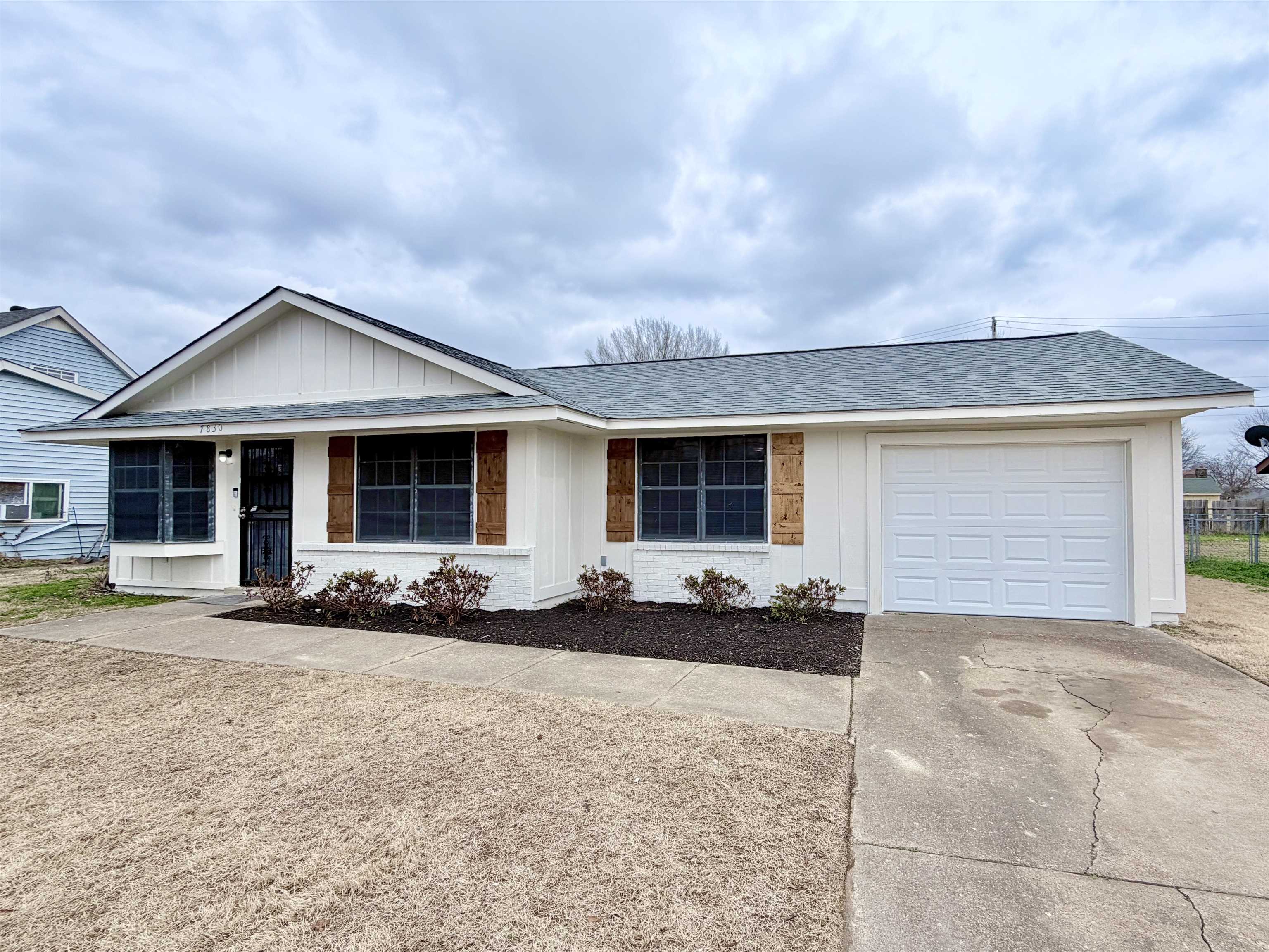 7830 Quito Road Millington, TN 38053 - Photo 24 of 26 a front view of a house with a yard