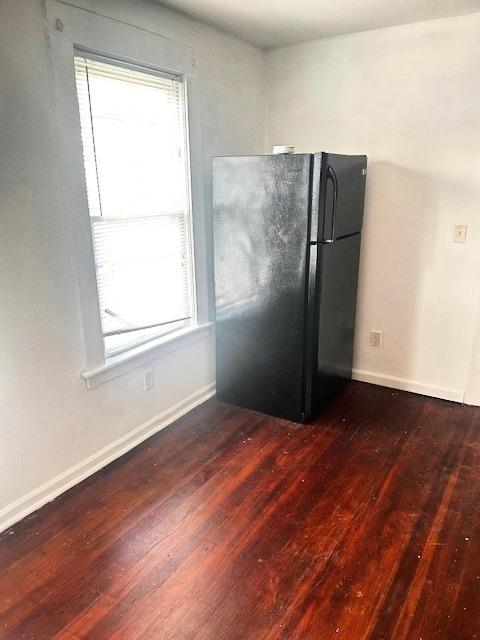 82 North Hamilton Street, Unit 1 Poughkeepsie, NY 12601 - Photo 6 of 8 an empty room with wooden floor and a window