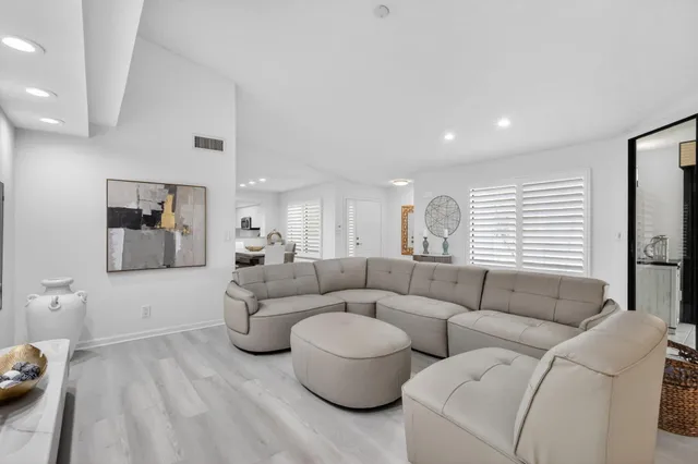 a spacious bedroom with a bed and window