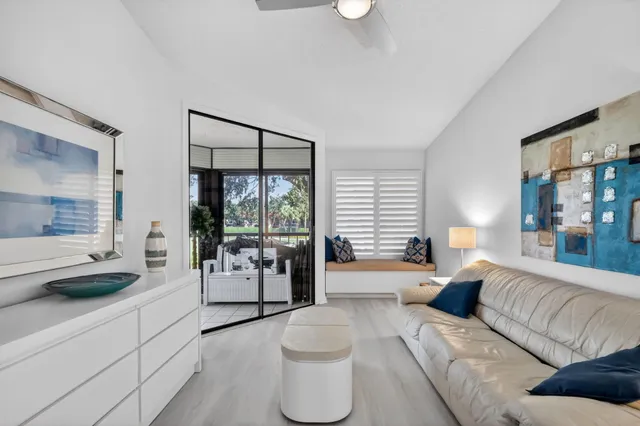 a view of a dining room with furniture and a window