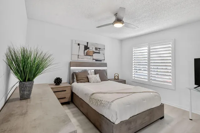 a living room with lots of furniture and a large window