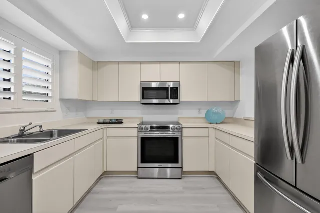 a kitchen with a sink and cabinets