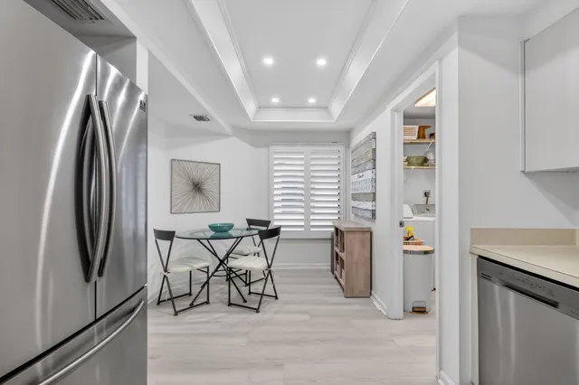 a view of living room with furniture and a flat screen tv