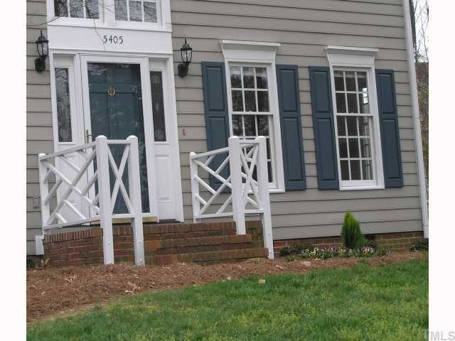 5405 Islehurst Court Raleigh, NC 27613 - Photo 2 of 12 a front view of a house with garden