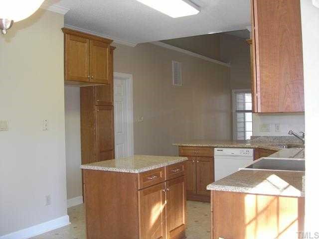 5405 Islehurst Court Raleigh, NC 27613 - Photo 4 of 12 a kitchen with a sink and cabinets
