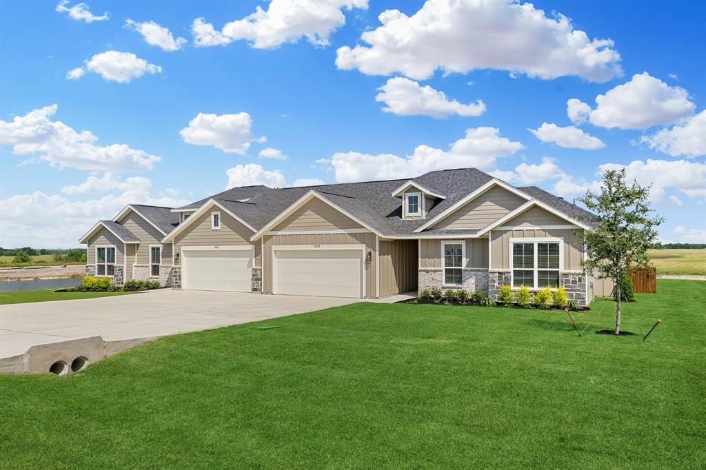 7050-7052 Guilford Road Midlothian, TX 76065 - Photo 5 of 36 a front view of a house with garden