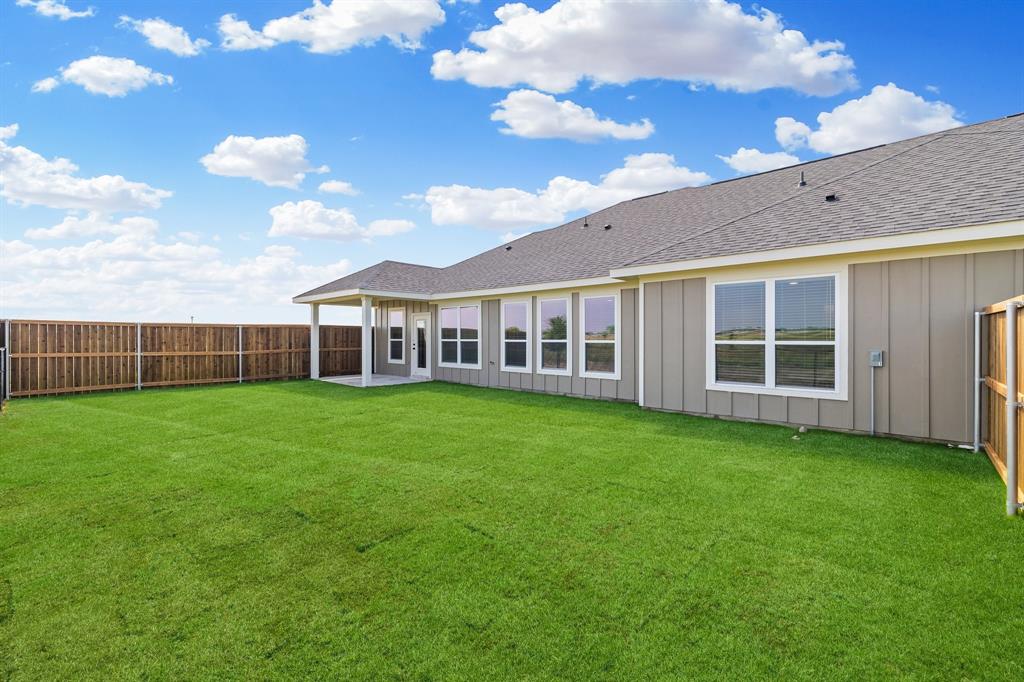 7050-7052 Guilford Road Midlothian, TX 76065 - Photo 8 of 36 a view of a house with backyard